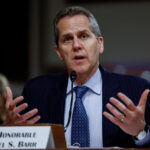 Read more about the article Fed’s Barr Urges Caution With Further Rate Moves, Underscoring Committee’s Divisions