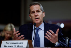 Read more about the article Fed’s Barr Urges Caution With Further Rate Moves, Underscoring Committee’s Divisions