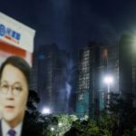 Read more about the article Hong Kong faces low election turnout as residents mourn deadly fire