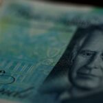Read more about the article Pound softens as UK consumers cut spending, public finances worsen
